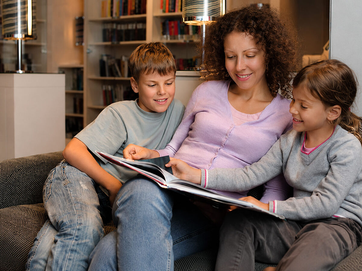 Parent reading with children at home